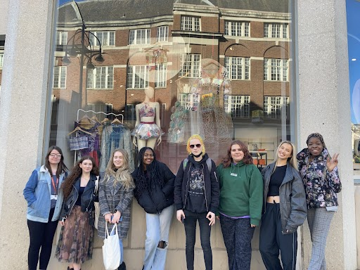 Leeds City College students outside their sustainable fashion window display at John Lewis